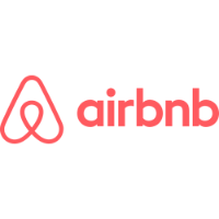 A red logo for airbnb on a black background